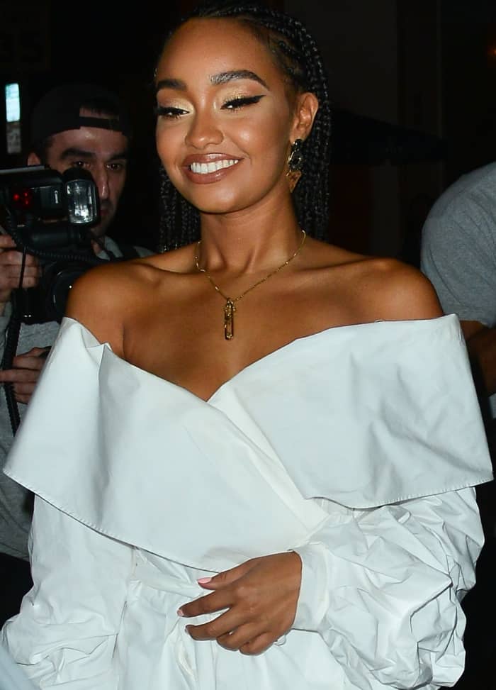 Leigh-Anne Pinnock's wrap shirt features oversized ruffle cuffs, a self-tie detail, and a relaxed fit