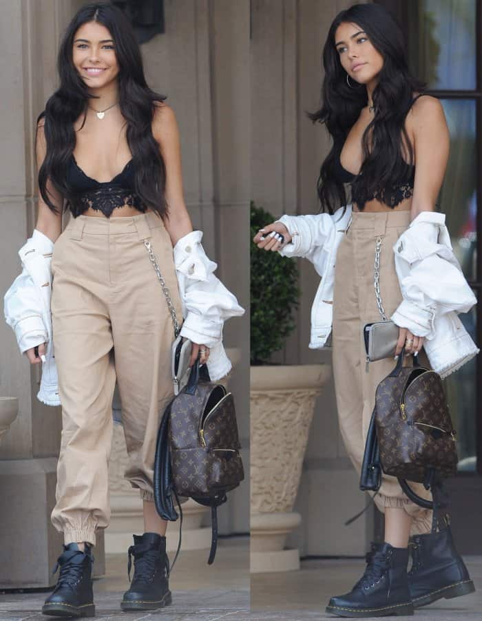 Madison Beer styled a racy black top with a BDG ivory denim trucker jacket