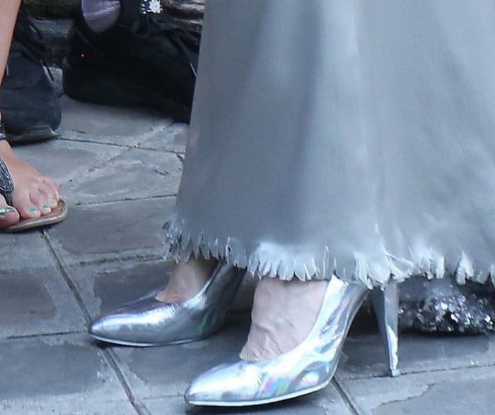 Tilda Swinton wearing metallic silver pumps at the Vogue Paris Foundation dinner