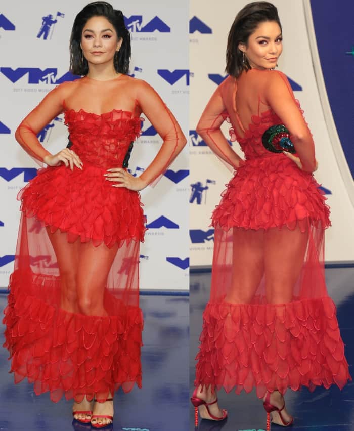 Vanessa Hudgens's red dress was a standout, featuring sheer fabric from the neckline and sleeves down to a daring cutout panel at the knees