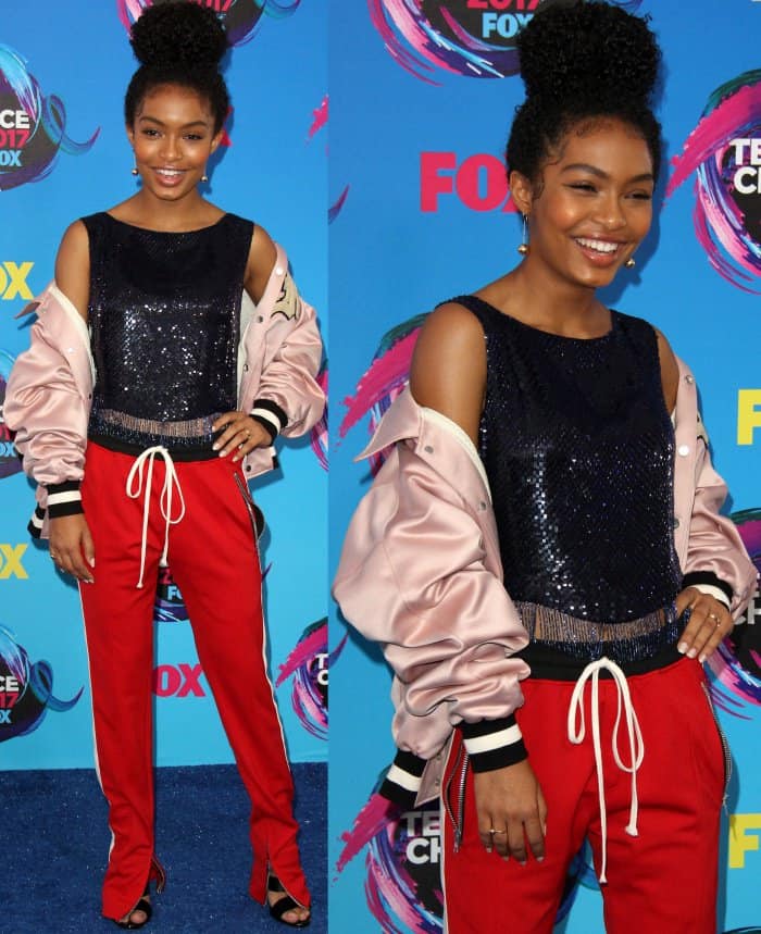 Yara Shahidi confidently paired a sequined top from Libertine with sporty track pants and a millennial-pink bomber jacket from Fear of God