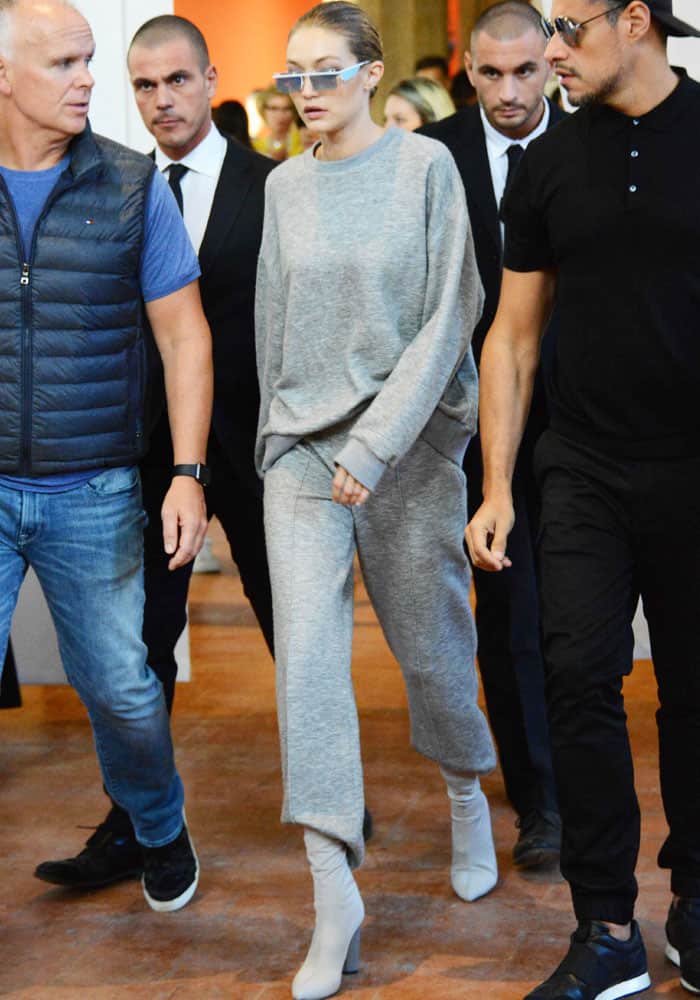 Gigi exits the show in an all-gray ensemble