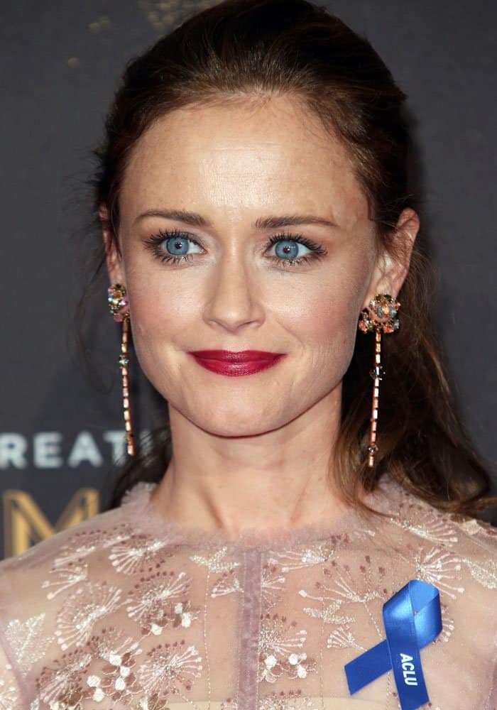 The soft rose hue of Alexis Bledel's gown beautifully complemented her fair complexion, brunette locks, and striking blue eyes at the 2017 Creative Arts Emmy Awards