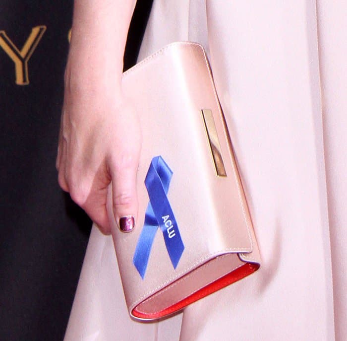 Elisabeth Moss carrying a special clutch at the Emmy Awards.
