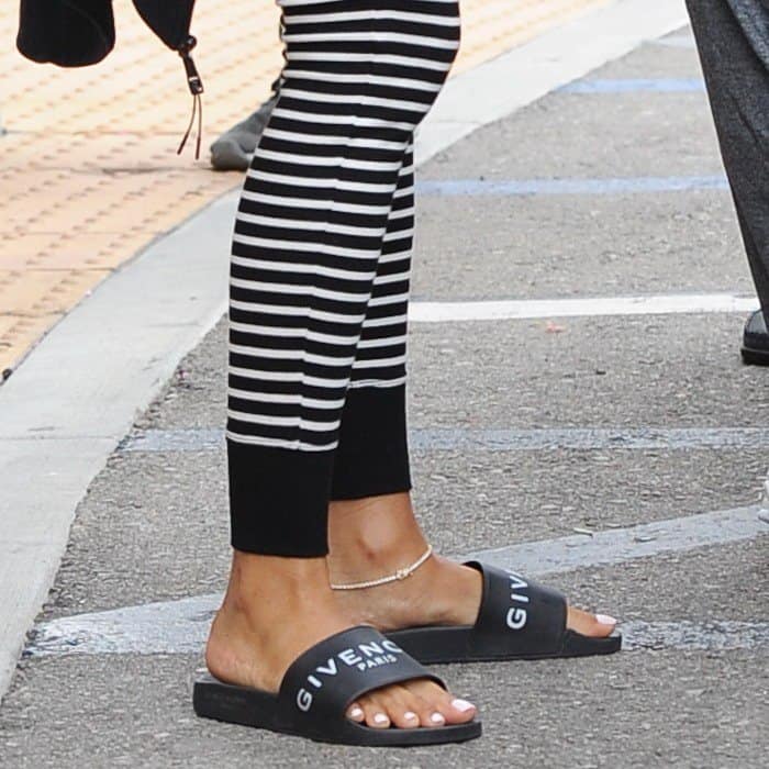 Eniko Hart showing off her anklet and feet in Givenchy slide sandals