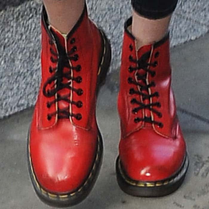 Gigi Hadid accentuates her outfit with bright red Dr. Martens boots