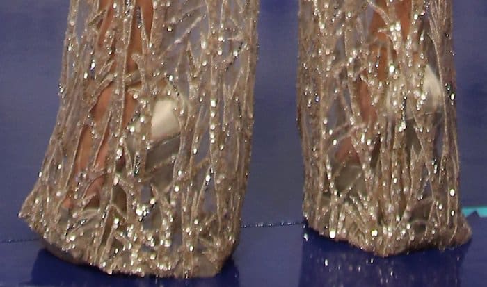 Hailey Baldwin in a silver sheer Zuhair Murad jumpsuit and Jimmy Choo "Pearl" platform sandals.