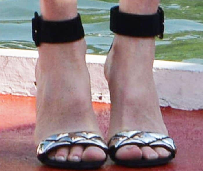 The actress adorns her toes with a pair of Louis Vuitton "Silver Lining" sandals