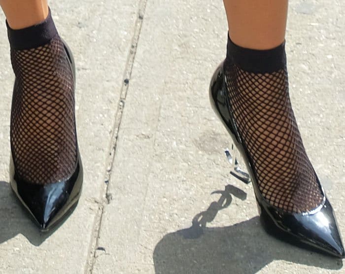 Karrueche matches stocking socks with her Saint Laurent "Opyum" pumps