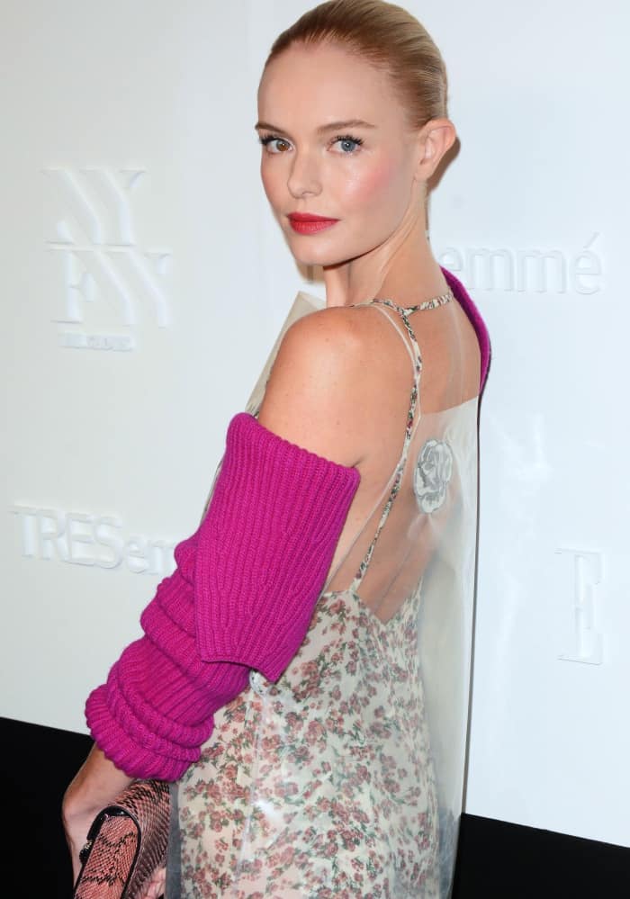 Kate Bosworth in a floral, coated shift dress paired with separate pink wool and cashmere sleeves