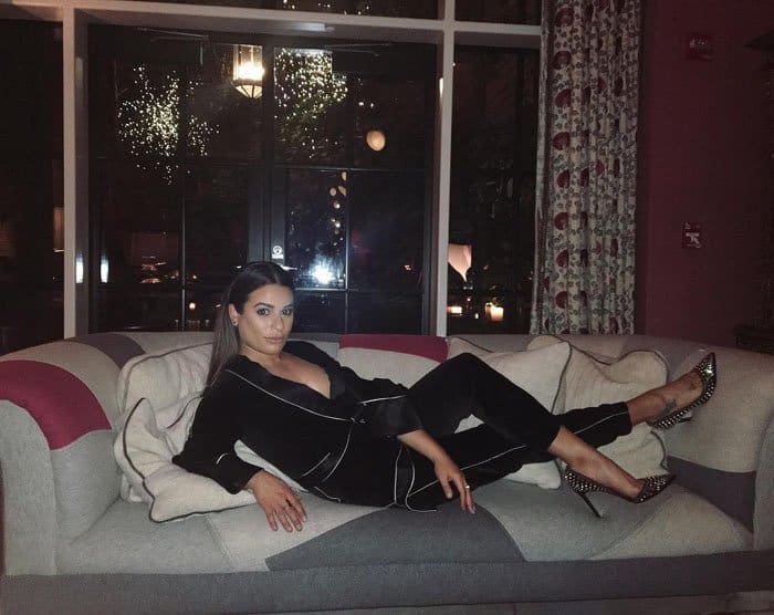 Lea uploads a photo of herself on a couch captioned, "This seat's taken"
