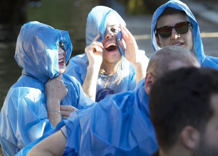 The actress wore a waterproof poncho over her clothes before the ride started