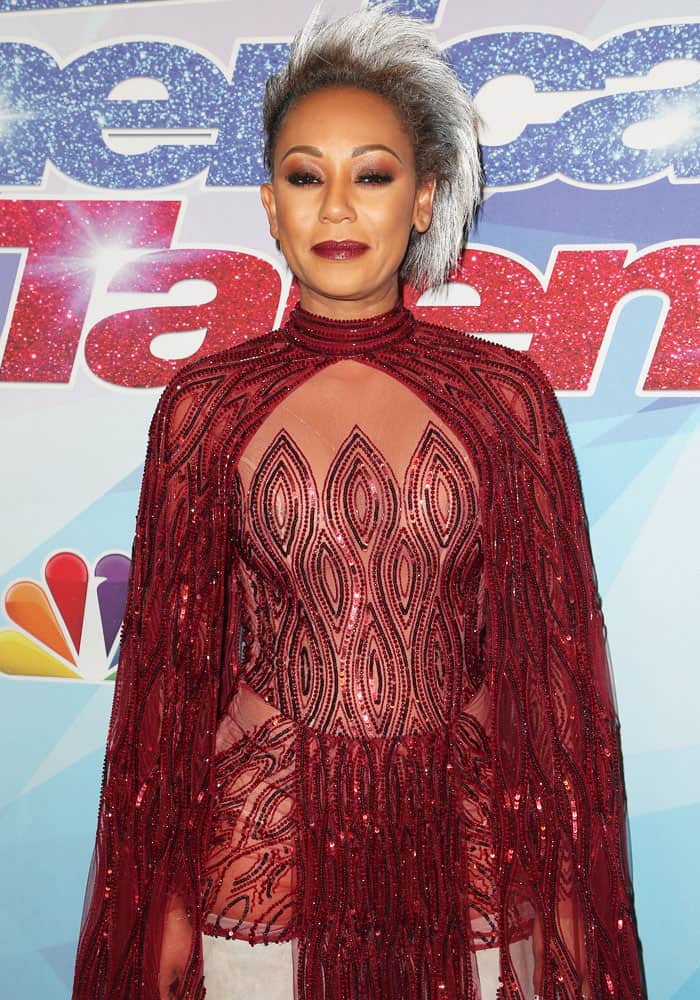 Mel B. matches her red outfit with red-toned makeup