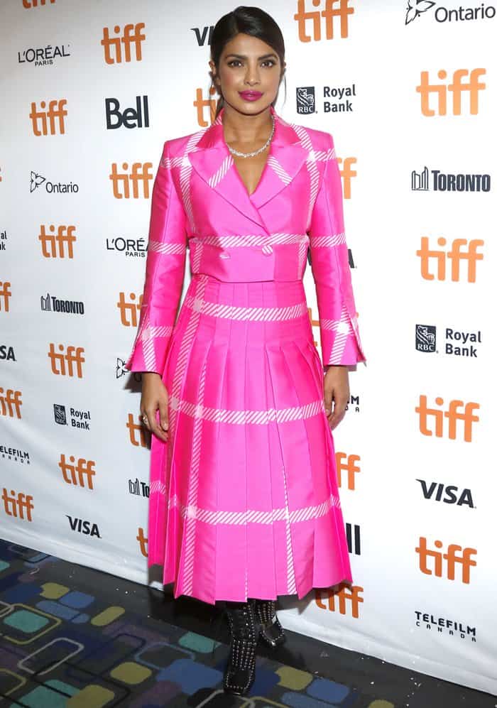 Priyanka Chopra attends the premiere of "Pahuna: The Little Visitors" at the Toronto International Film Festival in a pink Fendi suit paired with studded, ankle booties on September 7, 2017