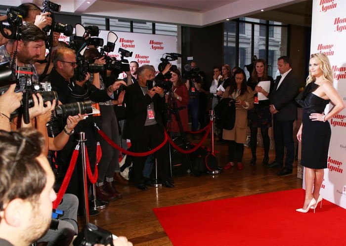 Paparazzi hound Reese at her movie premiere in London