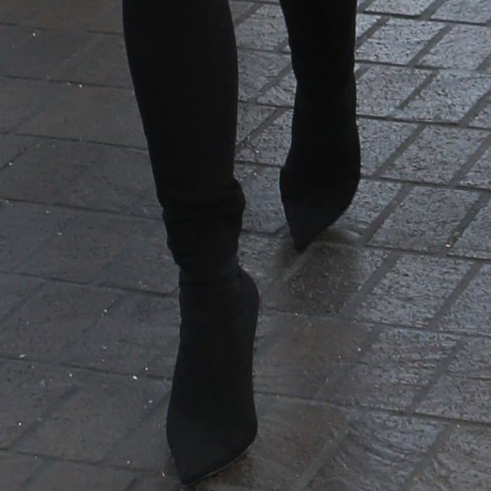 Chrissy Teigen wearing Balenciaga stretch-jersey sock boots at LAX