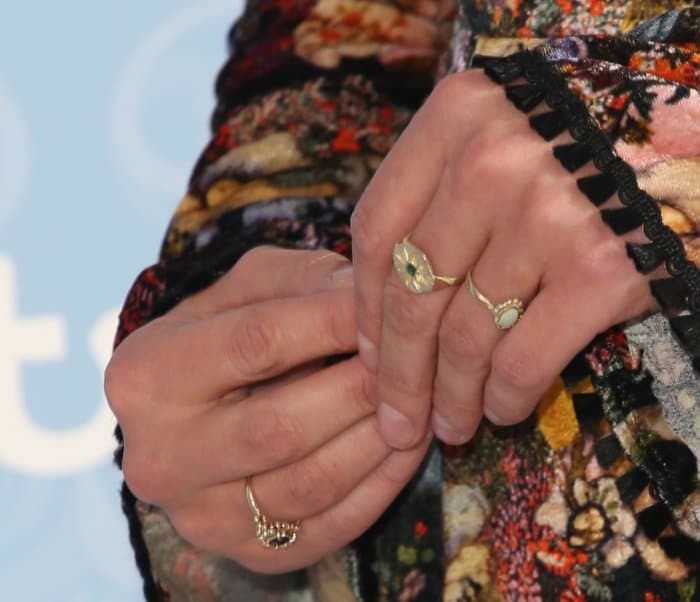 Jenna Coleman wearing the Erdem "Zuzanna" silk dress and an assortment of rings at the season 2 premiere of "Victoria" in London