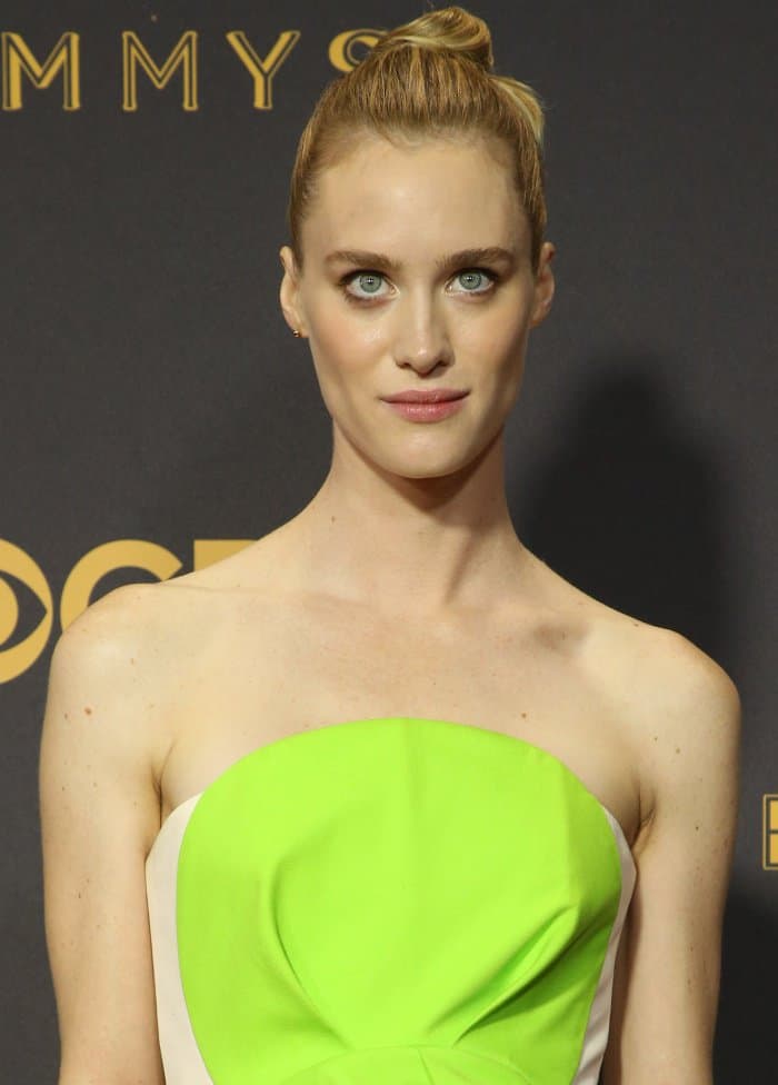 Mackenzie Davis with a sculptural updo, minimal makeup, and jewelry from Tiffany and Anita Ko