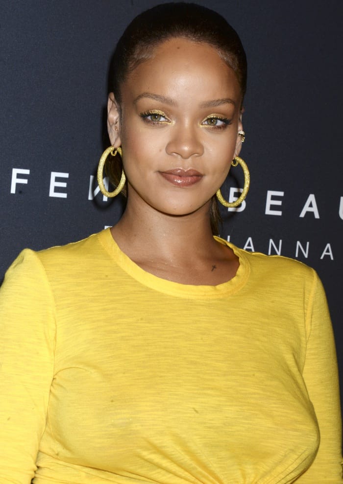 Rihanna amplified the look with lavish jewelry from Chopard and Anita Ko, making a bold statement