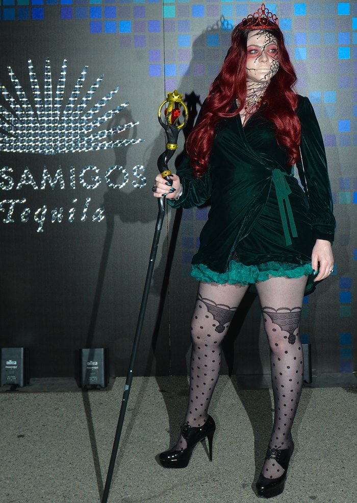 Michelle Trachtenberg stuns as Persephone, Queen of the Underworld, in an elaborate costume with intricate face makeup and regal accessories at the Casamigos Halloween Party