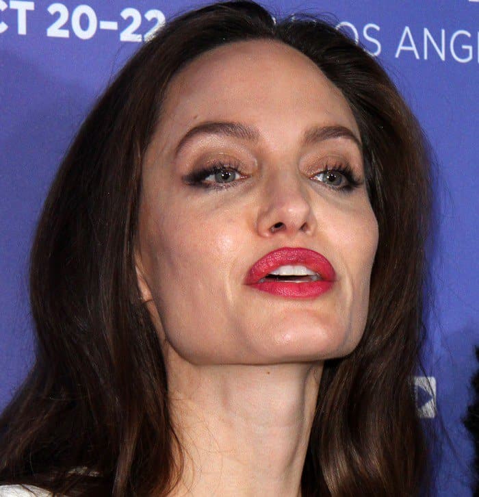 Angelina Jolie showcases bold red lipstick and soft eye makeup