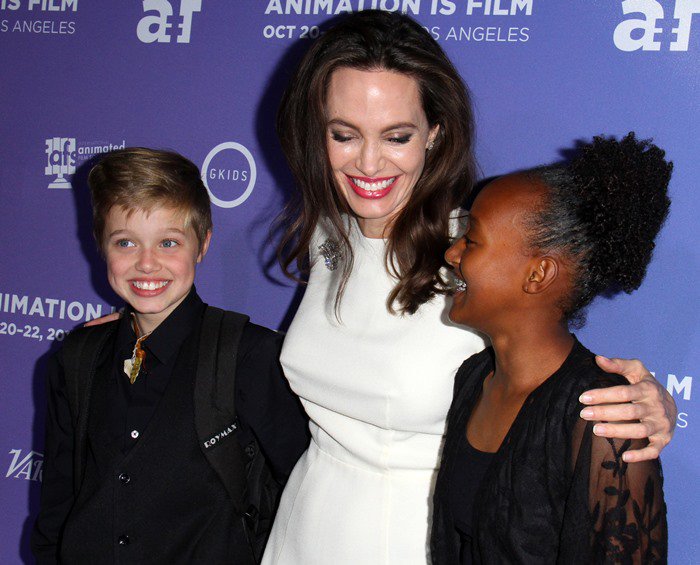 Angelina Jolie posing with her children, Shiloh Nouvel Jolie-Pitt and Zahara Marley Jolie-Pitt