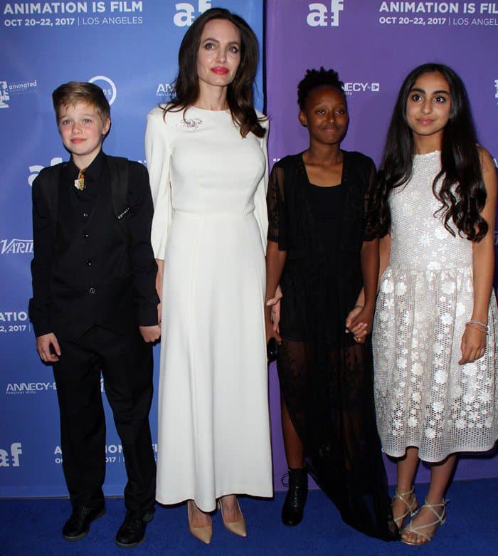 Angelina Jolie posing with her children, Shiloh Nouvel Jolie-Pitt and Zahara Marley Jolie-Pitt, and Canadian actress Saara Chaudry