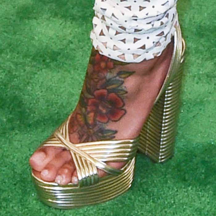 Blac Chyna shows off her tattooed feet in gold Aquazzura Sundance sandals