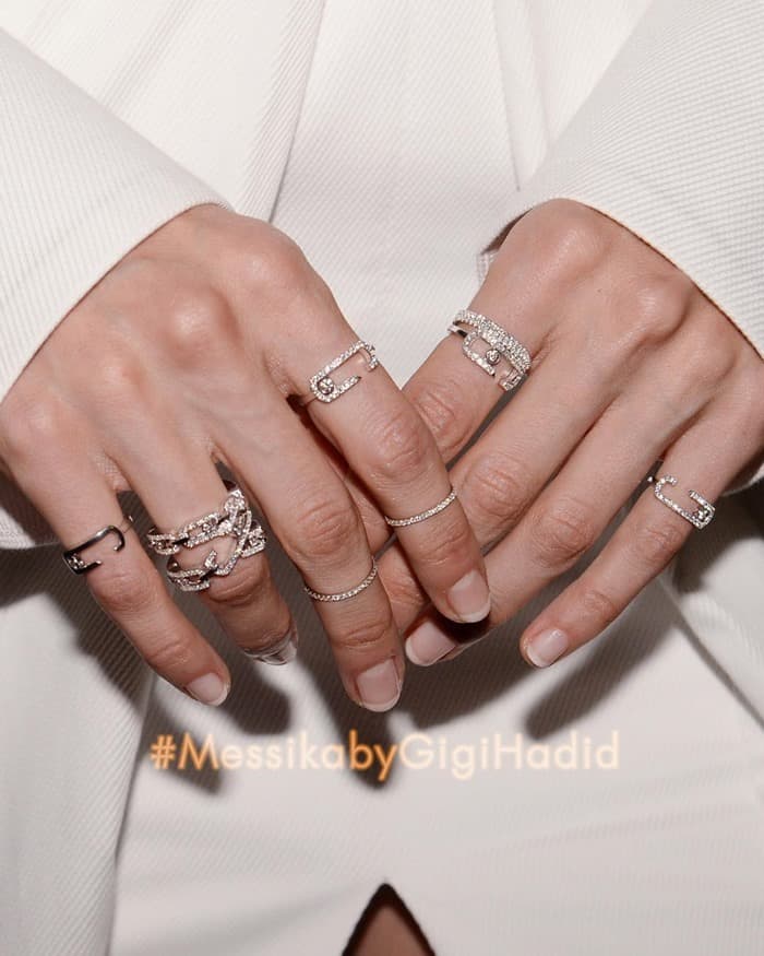 Image shared by Messika with the caption "Gigi Hadid playfully mixes and matches her Move Addiction, Move High Addiction and Gatsby rings. #MessikabyGigiHadid#10YearsofMove#DiamondAddiction#messikajewelry#GigiHadid"