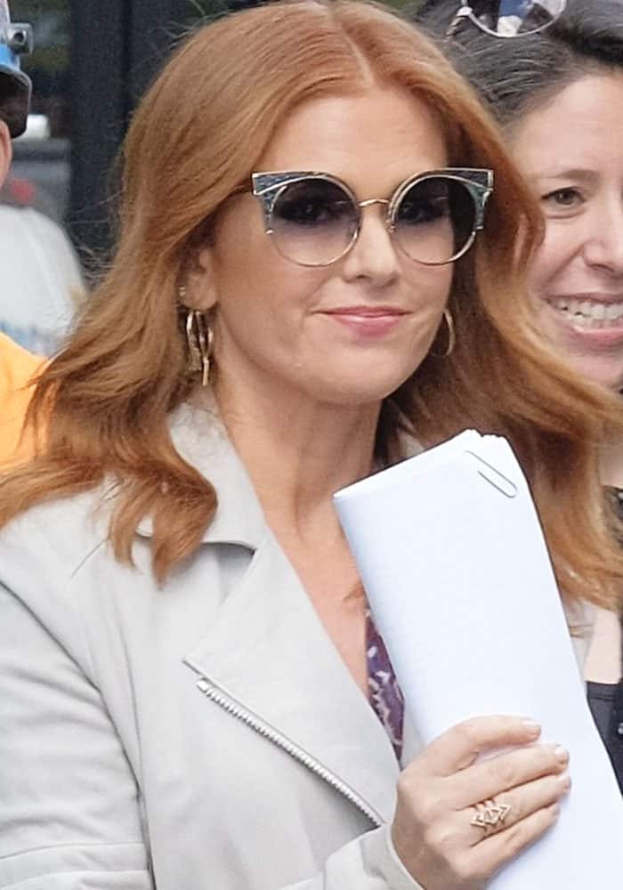 Isla Fisher wears her hair down as she arrives at the AOL Building