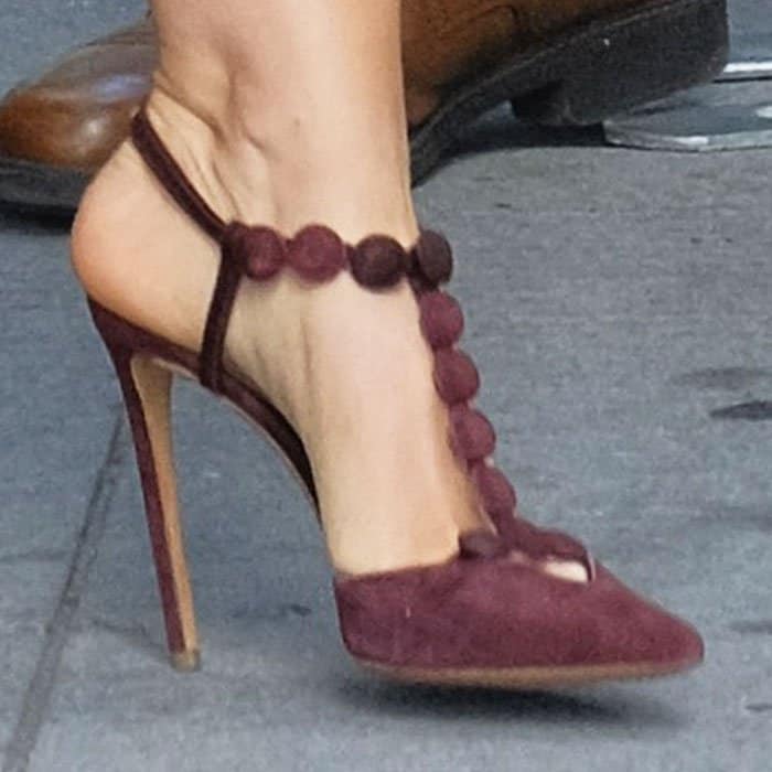 Isla Fisher's feet in purple suede Nicholas Kirkwood pumps