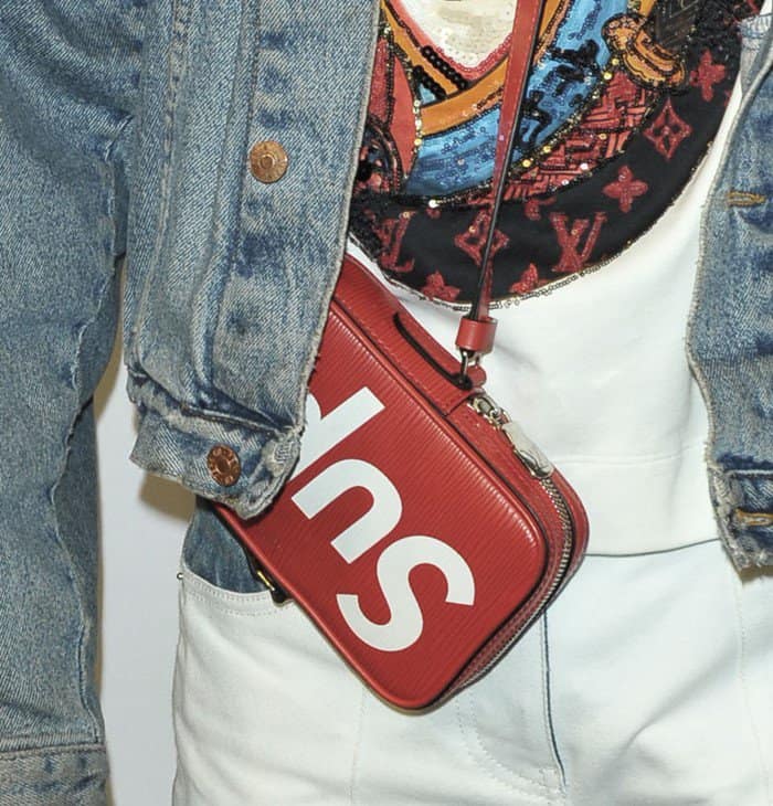 Jaden carrying a Just Water boxed water — an environmentally friendly alternative to bottled water