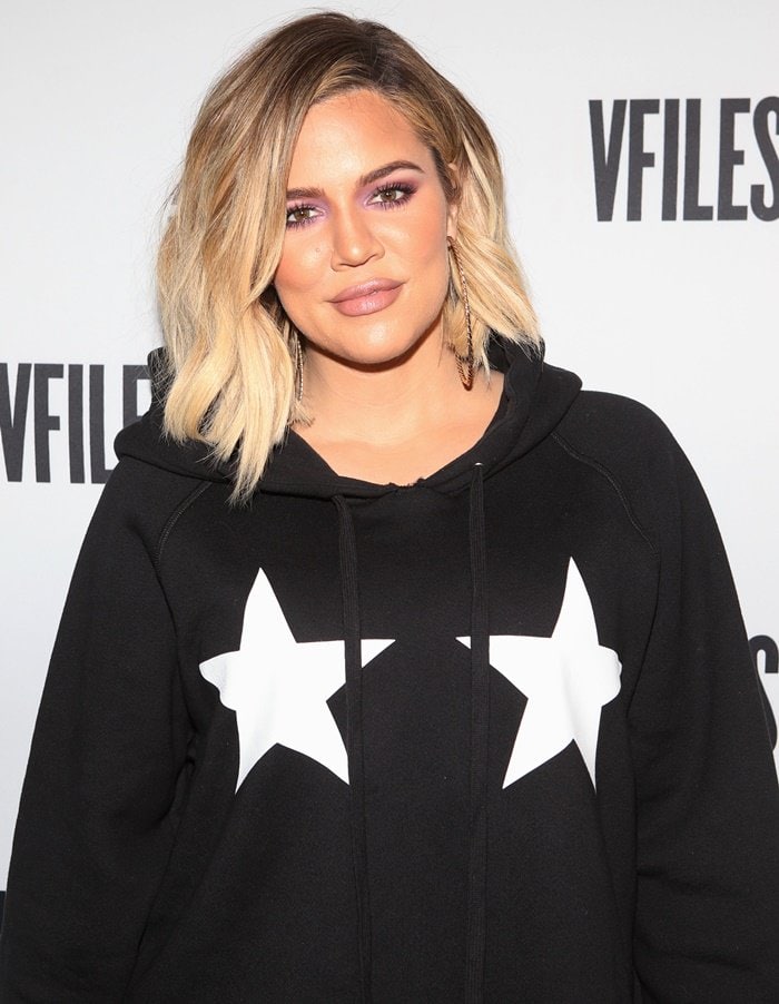 Khloé Kardashian wearing a sweatshirt dress at a fashion launch party in NY.