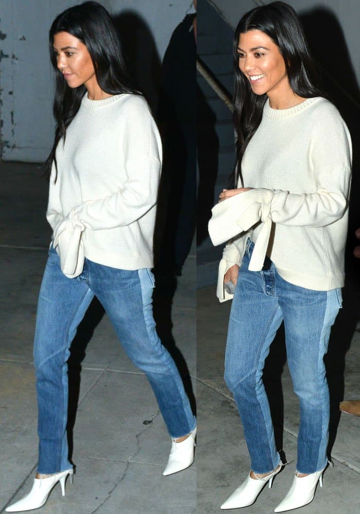 Kourtney wears a cozy Designer Remix "Sydni" sweater with bow sleeves