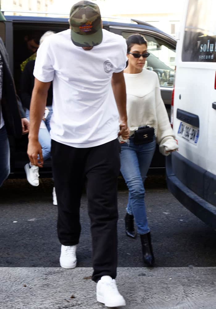 Kourtney Kardashian and her boyfriend Younes Bendjima emerge from a car in Paris