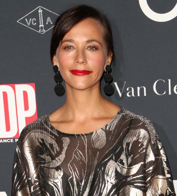 Rashida Jones completed her metallic look with bold tiered pompom earrings that added texture and a playful twist to her red carpet ensemble