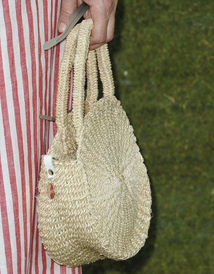 Kate Hudson carries a straw bag at the 8th Annual Veuve Clicquot Polo Classic at Will Rogers State Historic Park.