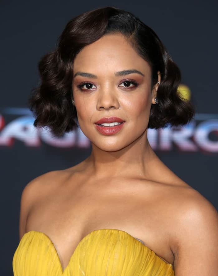 Tessa Thompson attends the world premiere of 'Thor: Ragnarok" in a yellow gown.