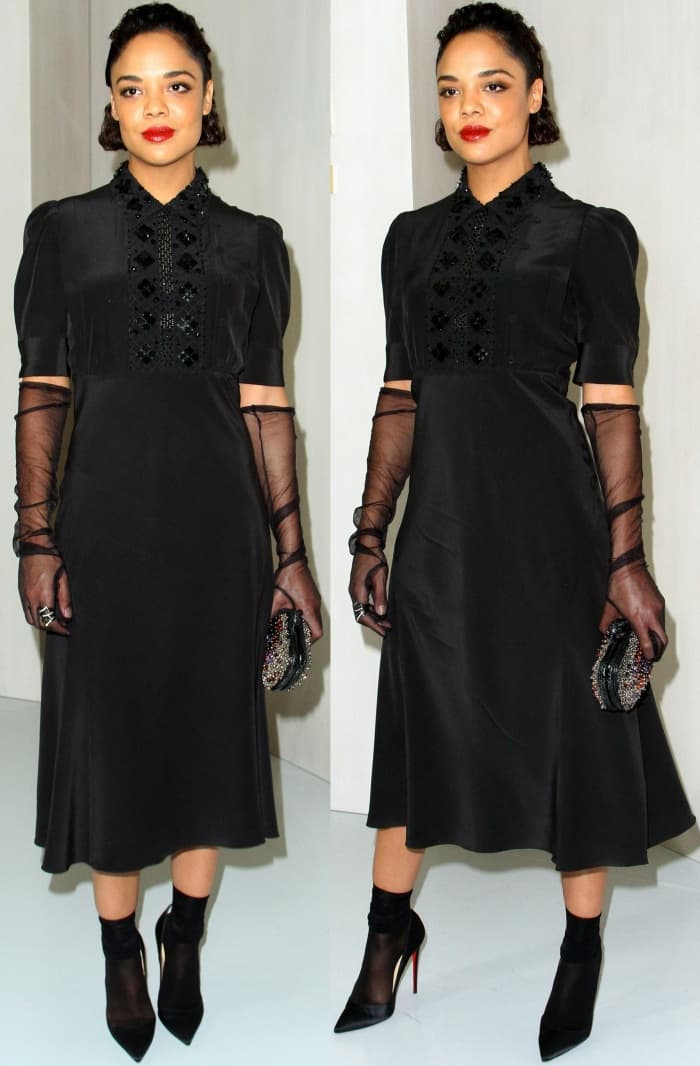 Tessa Thompson brings dramatic flair to the Hammer Museum Gala in a black Bottega Veneta dress, sheer gloves, and black pointy-toe pumps styled with sheer socks and a crystal-embellished clutch