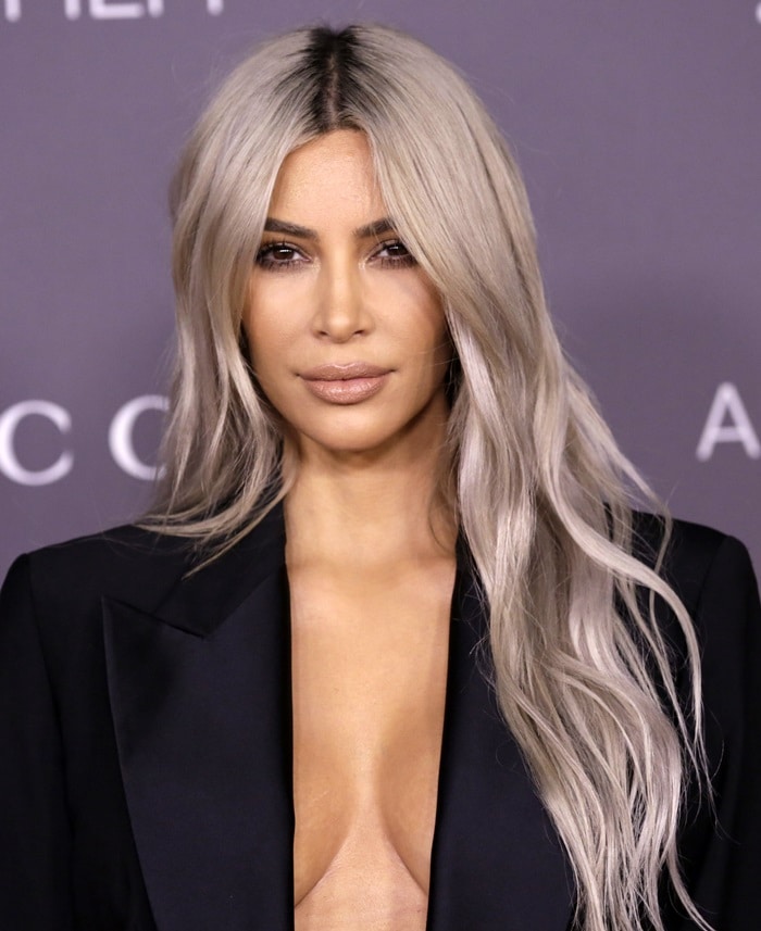 Kim Kardashian makes a bold fashion statement in a braless vintage Tom Ford tuxedo at the 2017 LACMA Art + Film Gala
