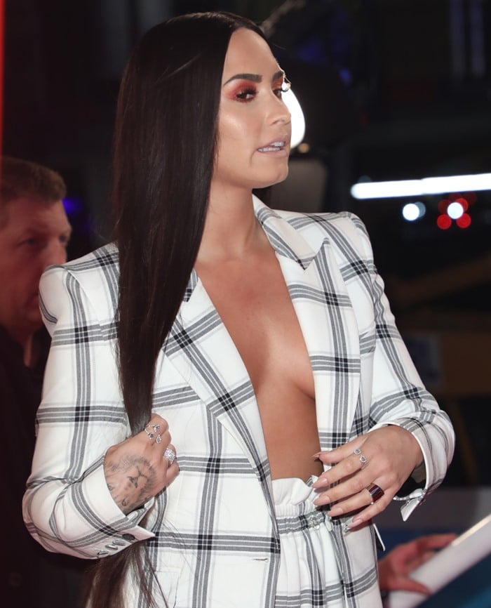 Demi Lovato wearing a Styland suit at the 2017 MTV EMAs red carpet at The SSE Arena in Wembley in London, England, on November 12, 2017