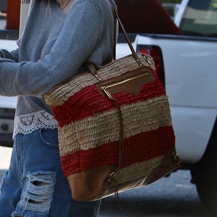 Emma Roberts toting straw tote from Rebecca Minkoff