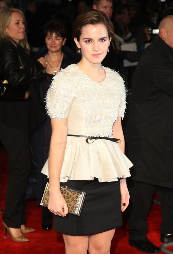 Emma Watson donned a cream top with a black ribbon-belted peplum and a shimmery, frippery-lined bodice designed by Jason Wu