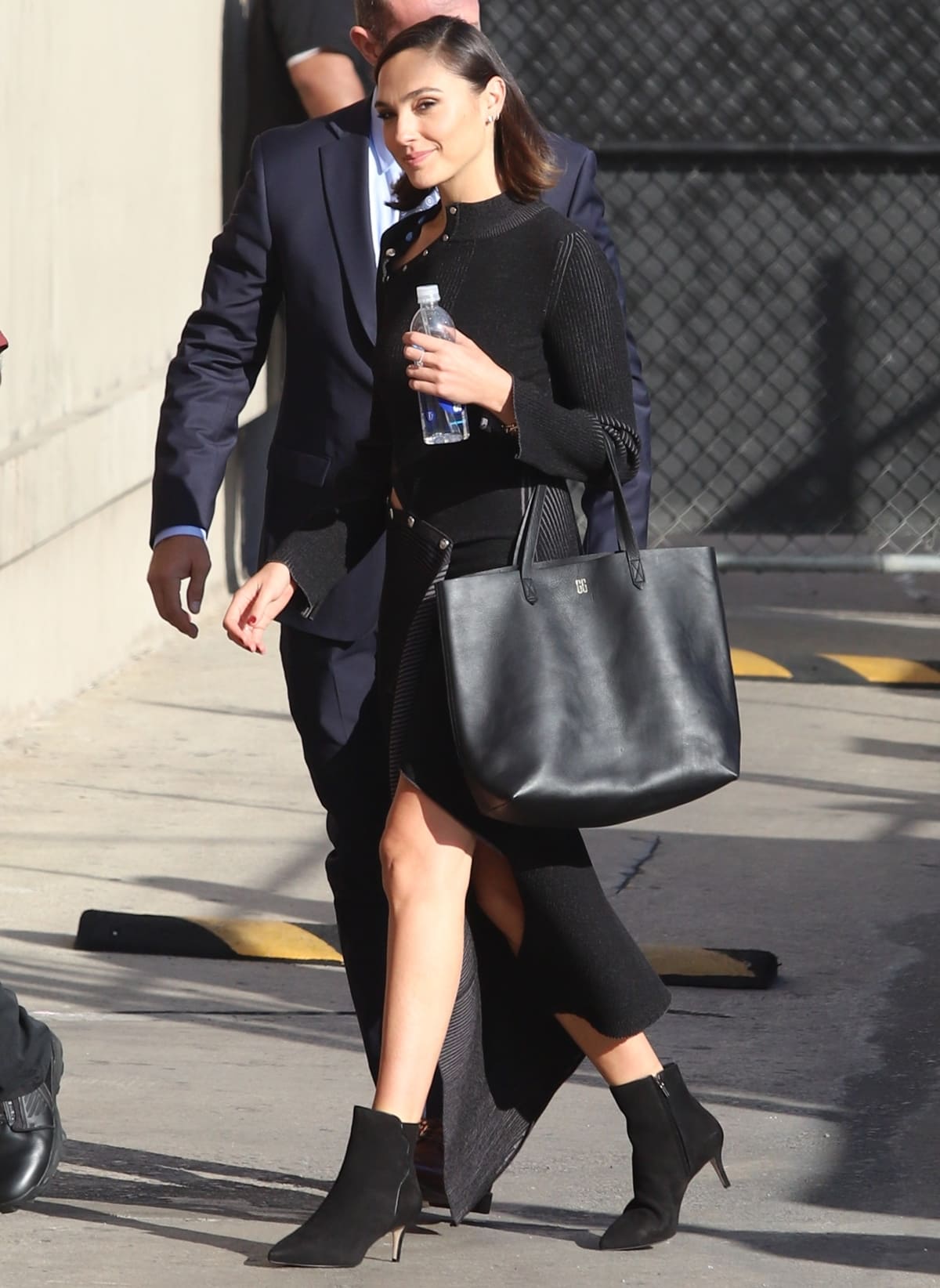 Gal Gadot wears Sarah Flint Perfect dress booties and carries a black Madewell Transport Tote