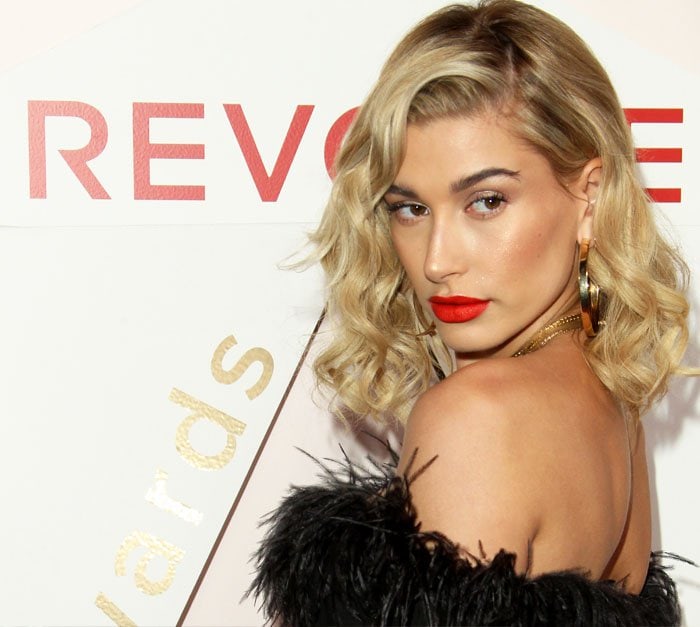 Hailey was all about the bronzer and red lips for the night