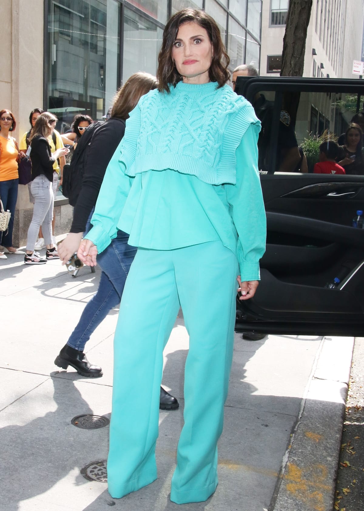 Arriving for a taping of the Today show in New York on August 17, 2023, Idina Menzel turned heads in a bold monochrome turquoise ensemble while promoting her new album Drama Queen