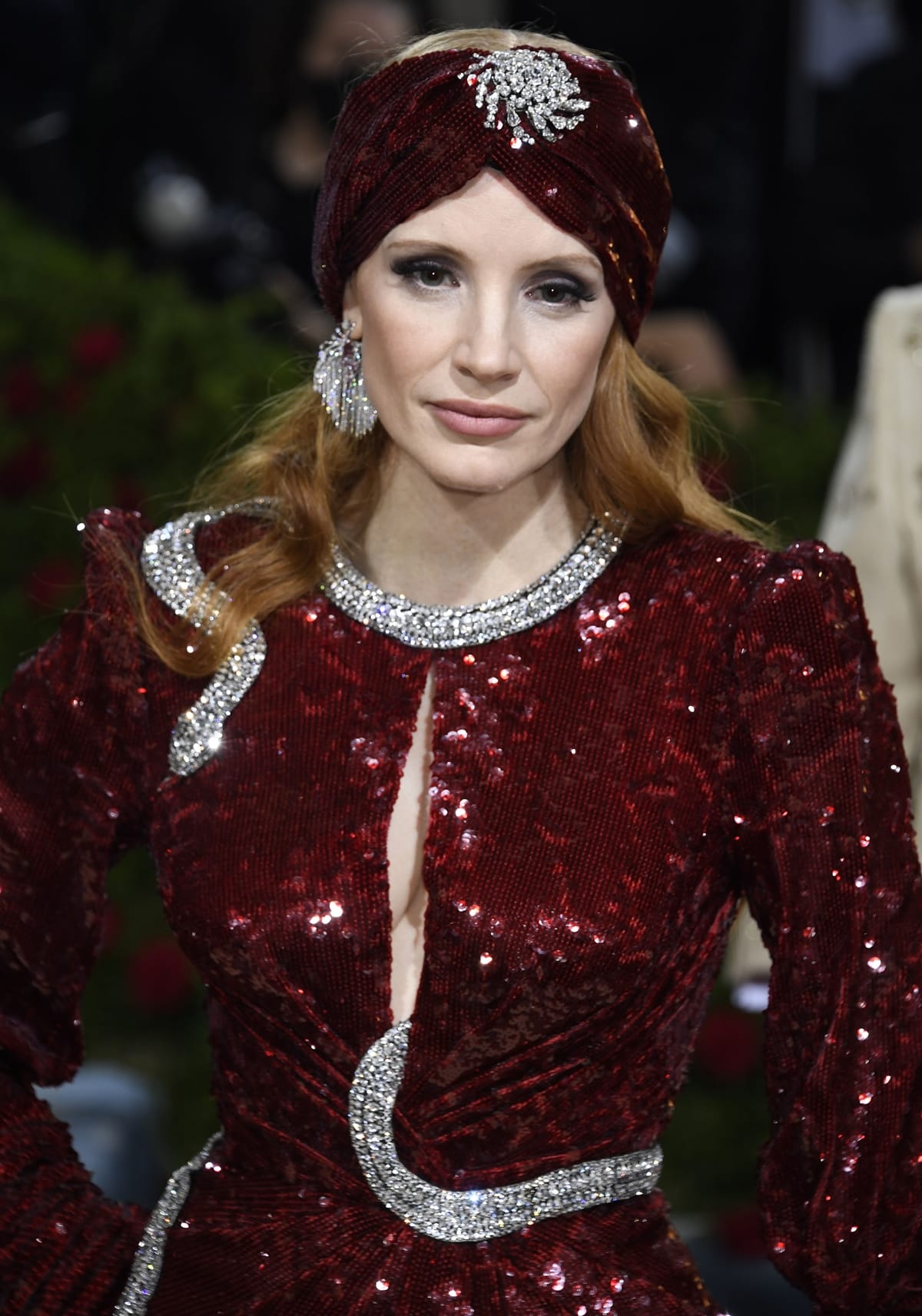 Jessica Chastain wears a Gucci gown featuring a central opening and winding crystal snake embroidery