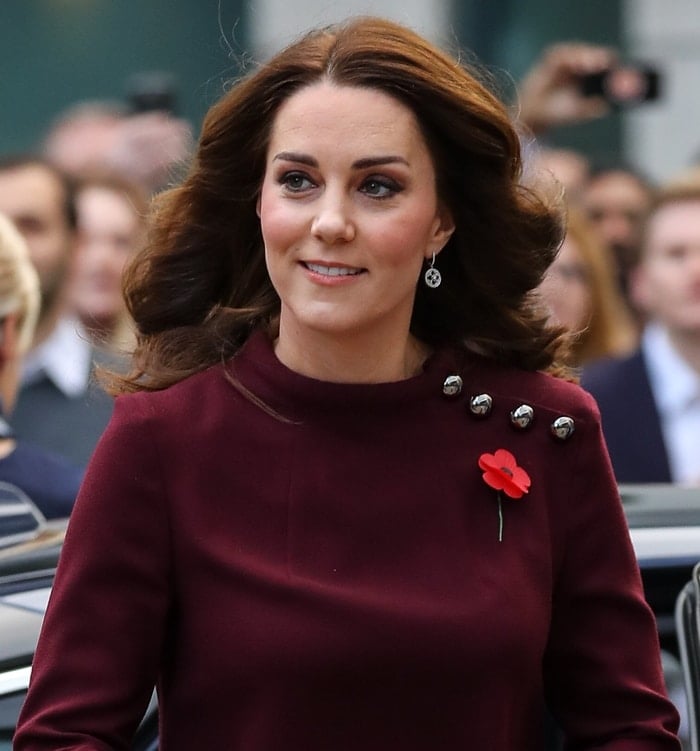 Kate Middleton wearing a flower pin at Place2Be's School Leaders Forum in London.