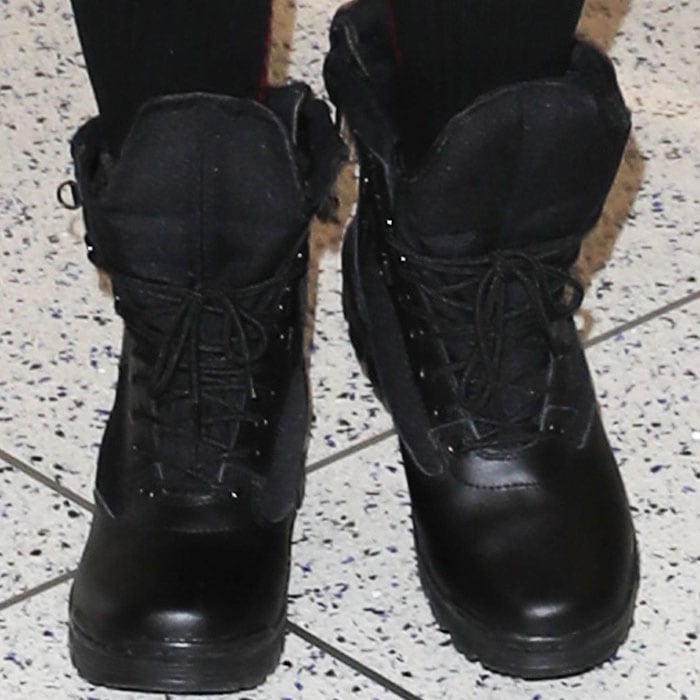 Khloe puts a pair of black combat boots under her list of travel footwear