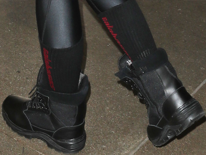 Khloe wears a pair of Yeezy "Calabasas" socks with her boots